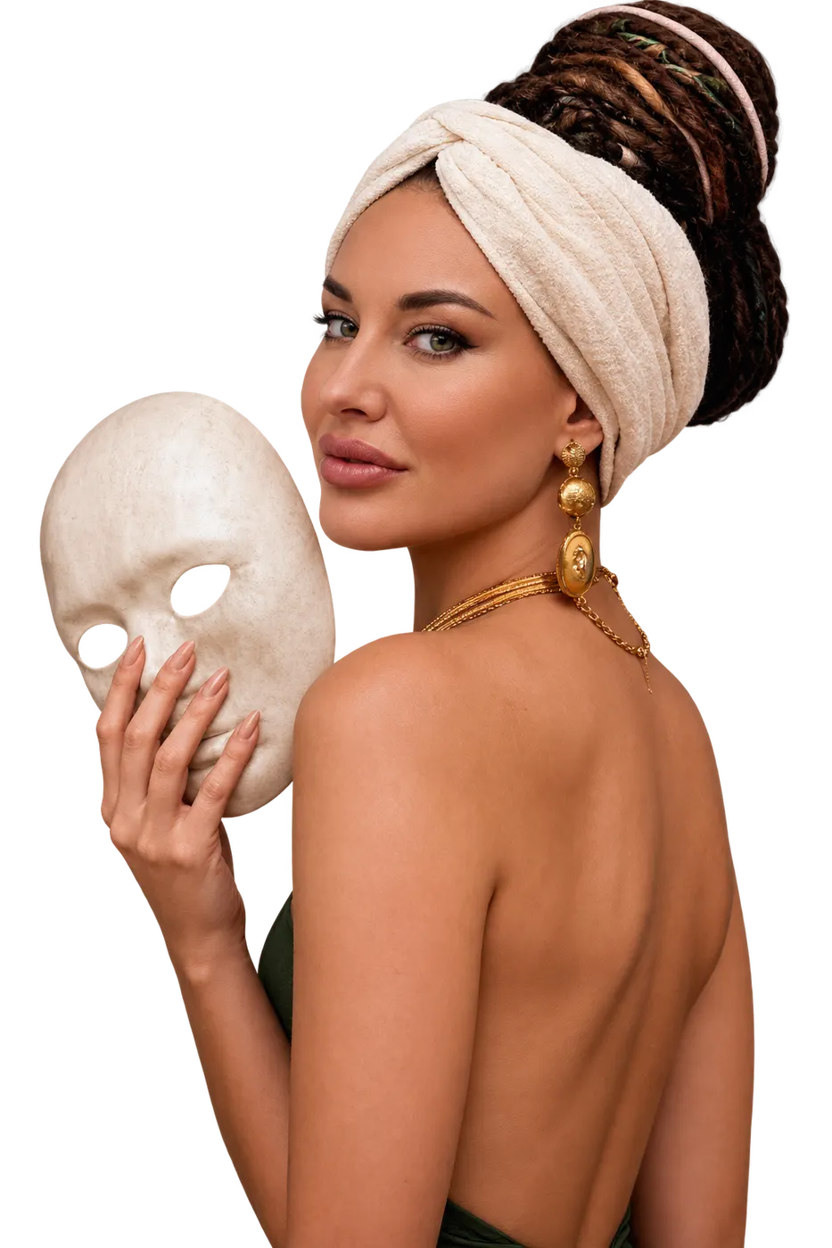 A woman holding a mask beside her face